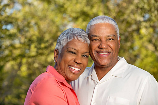 Old couple smiling with their Veneers